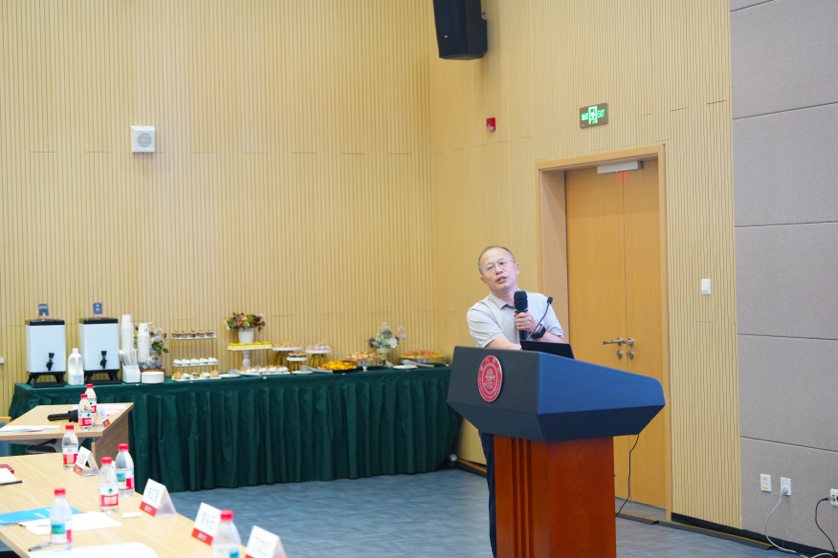 A person standing at a podium
Description automatically generated